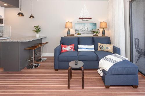 a living room with a blue couch and a table at River View Condo 602 & 603 in Wilmington