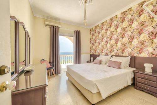 Ένα ή περισσότερα κρεβάτια σε δωμάτιο στο Villa Apolafste