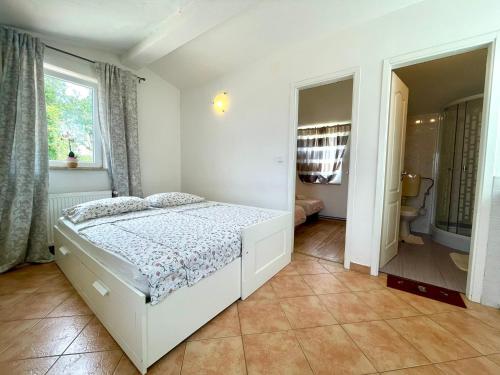 Postel nebo postele na pokoji v ubytování Apartments G&G