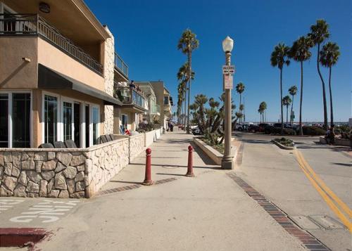 a street with orange cones on the side of a building at 2314 W Oceanfront A & B in Newport Beach