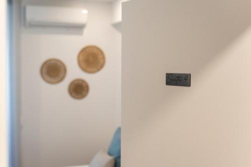 a white door with a sign that says sap on it at Madalena Hostel e Suites in Faro