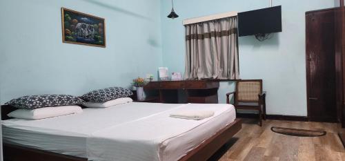 Postel nebo postele na pokoji v ubytování CHARAKAMA Guest Bungalow - GAMPAHA