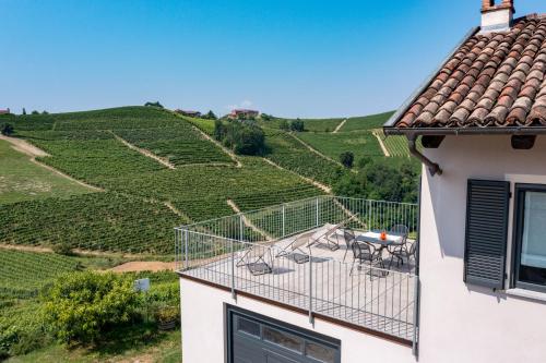 a balcony of a house with a view of a vineyard at Casa Pajè in Barbaresco