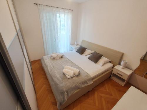 Postel nebo postele na pokoji v ubytování Apartment EMMI
