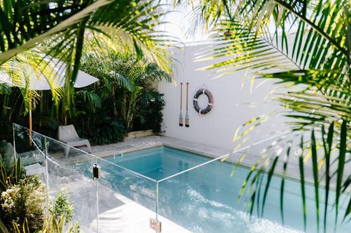 a swimming pool in the middle of a house at Finns at Old Bar in Old Bar