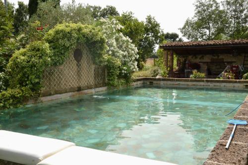 a swimming pool in the backyard of a house at I Fontanili in Civita Castellana