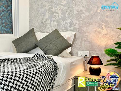 Postel nebo postele na pokoji v ubytování TheWave Residence By Heystay Management