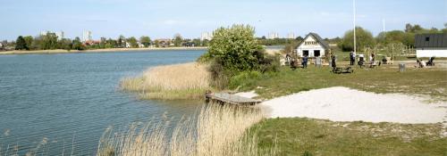 a house sitting next to a body of water at Cozy spot, Free Netflix and Prime in Vallensbæk