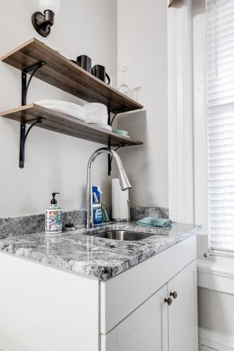 a kitchen with a sink and a counter top at G1 central location museums FREE PARKING in Richmond