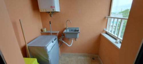 a small bathroom with a sink and a sink at Casamia in Follonica