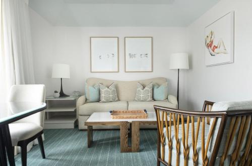 a living room with a couch and a coffee table at Chatham Bars Inn in Chatham