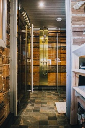 a bathroom with a shower in a room at Villa Aatos in Jyväskylä