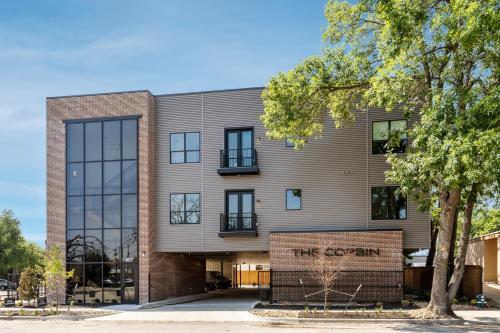 an office building with a sign in front of it at The Corbin 1204 - Magnolia Moderns in Fort Worth