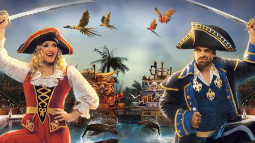 a woman and a man in pirate clothes in a pirate movie at Poplar Point Condo Unit 12A by Eden Crest in Pigeon Forge