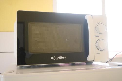 a computer monitor sitting on top of a counter at Appartement à 15min de belles plages in Sainte-Rose
