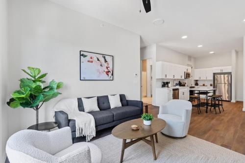 a living room with a couch and chairs and a table at The Corbin 1305 - The Columbia in Fort Worth