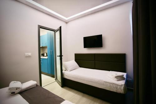 Ένα ή περισσότερα κρεβάτια σε δωμάτιο στο Ava Luxury Apartments