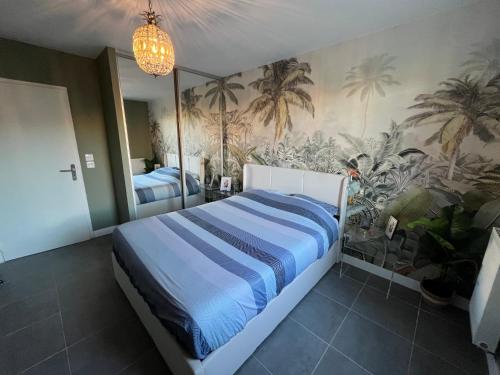 Ένα ή περισσότερα κρεβάτια σε δωμάτιο στο Appartement neuf avec jardin et parking dans résidence calme