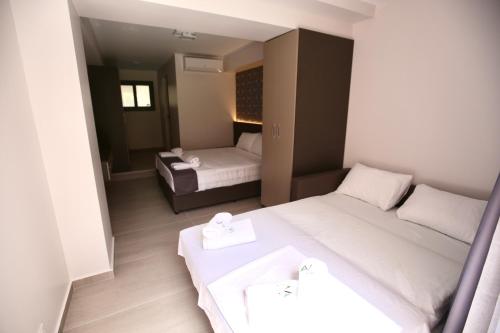 Ένα ή περισσότερα κρεβάτια σε δωμάτιο στο Ava Luxury Apartments