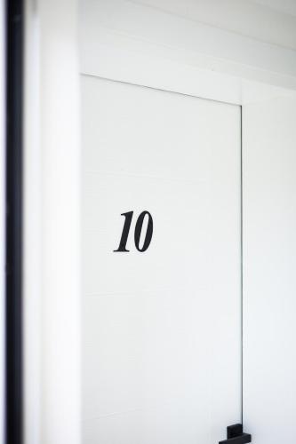 a room with a table with the number on it at Restoran & Motel Manjež in Bijelo Polje