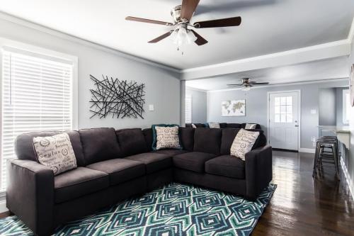 a living room with a couch and a ceiling fan at Winnetka Heights Hideaway in Dallas