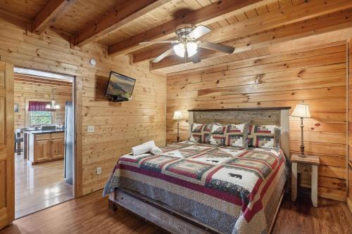 a bedroom with a bed and a ceiling fan at Amazing Grace #264 in Pigeon Forge