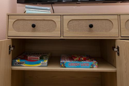 two boxes of candy land sitting on a shelf at Boise Owl House in Boise