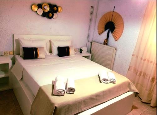 Postel nebo postele na pokoji v ubytování AGAPI apartments