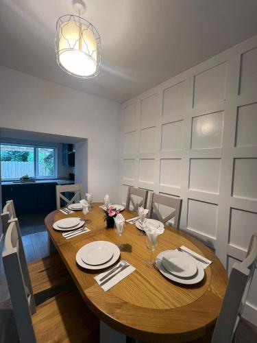 a dining room with a wooden table and chairs at 6 Eyre Square Lane in Galway