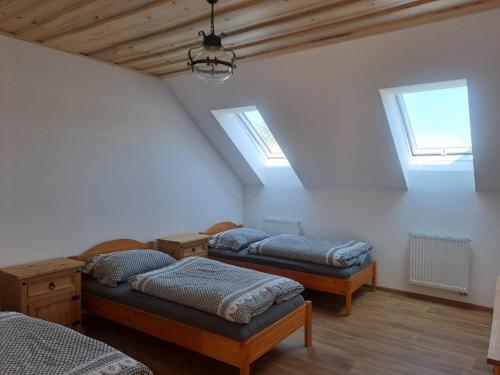 Postel nebo postele na pokoji v ubytování Pension Na Statku- Kočičí apartmán