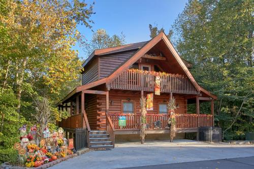 a log cabin with a porch and a deck at Boulder Bear Lodge #355 in Pigeon Forge