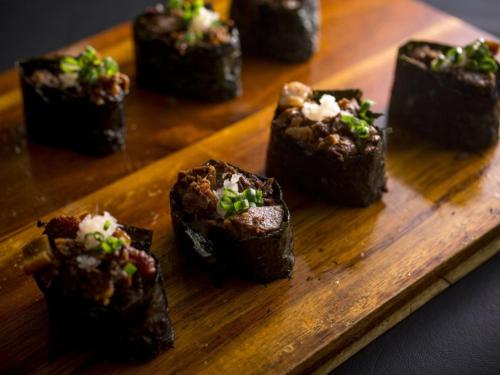 a wooden plate with some brownies on a table at Hotel Yagi - Vacation STAY 25619v in Awara