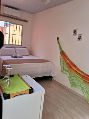 Postel nebo postele na pokoji v ubytování Aconchegante Suíte! Central!