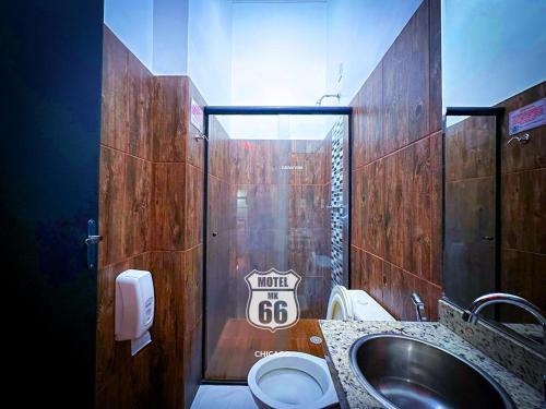 a bathroom with a sink and a toilet at MOTEL MK 66 in Mairinque
