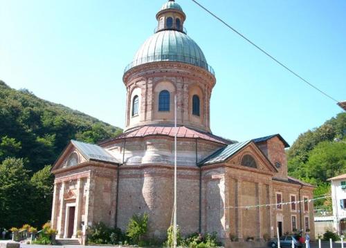 an old brick building with a tower on top of it at InCentro Millesimo in Millesimo