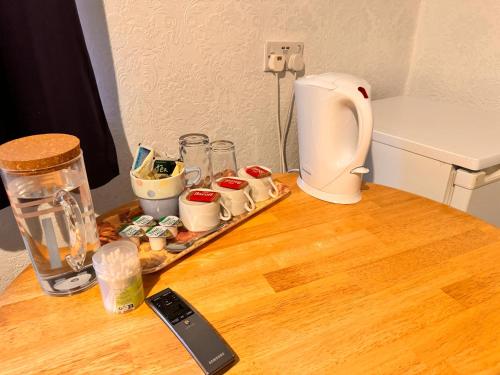 a tray of food on a table with a blender at All Seasons Gatwick Guest House & Parking in Horley