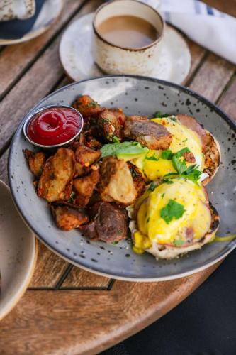 a plate of food with an egg and fried potatoes at Costanoa in Pescadero