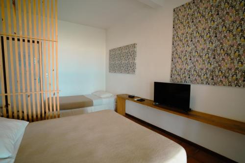 Postel nebo postele na pokoji v ubytování Zebra Boutique Hotel