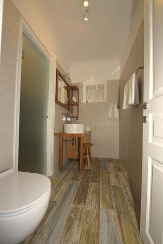 a bathroom with a toilet and a sink at Petrasdream Lefkada in Lefkada