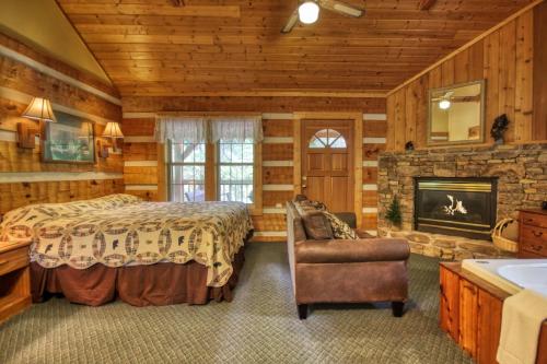 a bedroom with a bed and a fireplace at Cuddle Inn #1529 in Gatlinburg