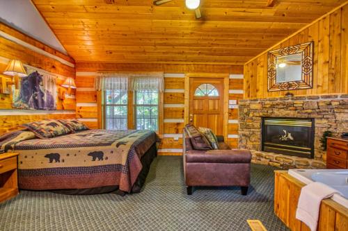 a bedroom with a bed and a fireplace at Dream Weaver #1527 in Gatlinburg