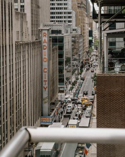 a view of a busy city street with traffic at The Jewel Hotel, New York in New York