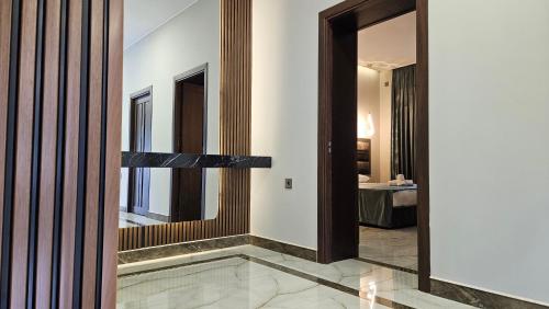 a hallway with a mirror and a room at Luxury Milan Mountain Ponoramic Villa, indoor heated pool and jacuzzi with mountain view in Gabala