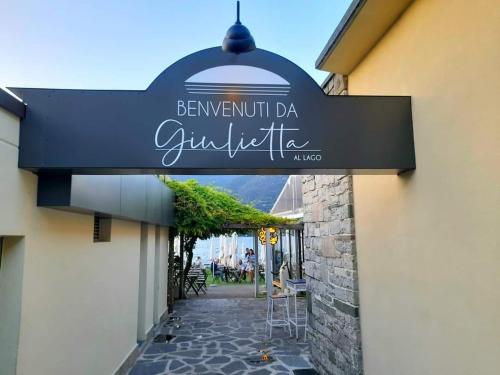 a sign for a restaurant on the side of a building at The window on the theatre and the cathedral - Luxury apartment in Como