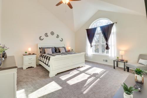 a bedroom with a white bed and a window at 3 Mi to Kalahari Pocono Summit Home with Pool Table in Pocono Summit