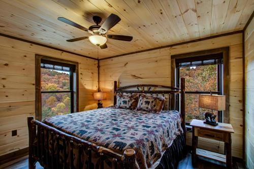 a bedroom with a bed and a ceiling fan at Honey Bear Hill #326 in Sevierville