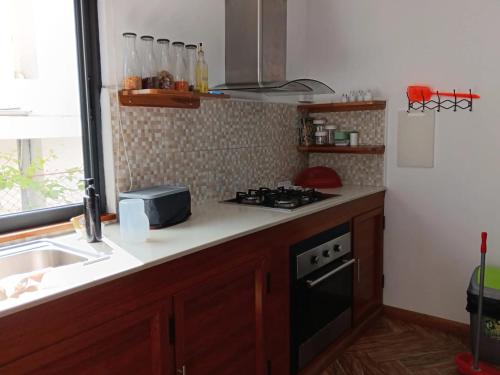 a kitchen with a sink and a stove at Fleur d'Epine in Trou dʼ Eau Douce