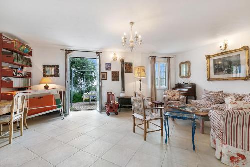 a living room with a couch and a table at Ca D'artista For Nature Lovers - Happy Rentals in Stellanello