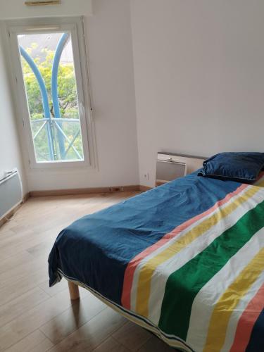 Llit o llits en una habitació de Duplex Rouen centre rive gauche