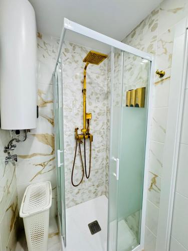 a shower with a glass door in a bathroom at Fuenlabrada in Fuenlabrada